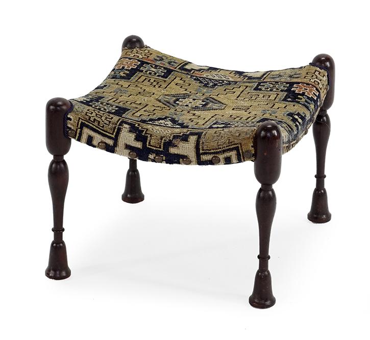 A Gustav Stickley Bungalow Stool.: A Gustav Stickley Bungalow Stool. Circa 1900, mahogany stool upholstered with a Persian textile fragment, unmarked 15" x 18 1/2" x 19"