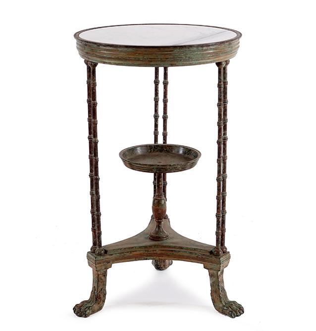 A French Bronze Gueridon.: A French Bronze Gueridon. Bearing an inset marble top, a tazza on the center supports, and raised on paw feet 31 1/2" x 19"