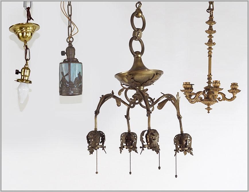 A Group of Four Light Fixtures.: A Group of Four Light Fixtures. Featuring an electric hanging fixture, a five light candelabra, a blue slag glass fixture and a small brass fixture missing the shade