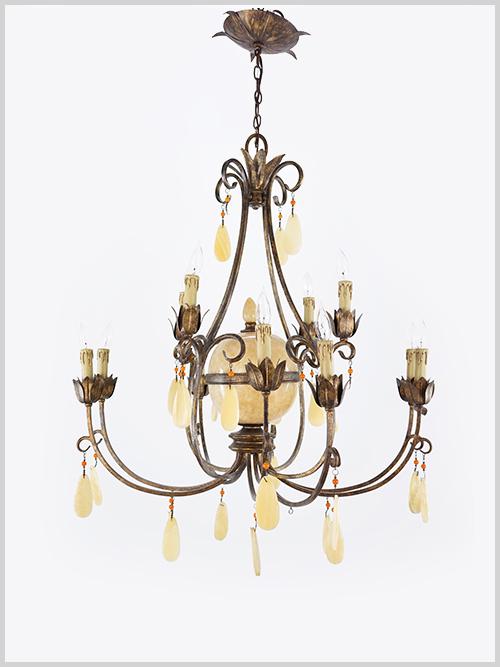 A Twelve-Light Chandelier.: A Twelve-Light Chandelier. Patinated metal frame with an onyx central globe and onyx pendants throughout 37" x 37"