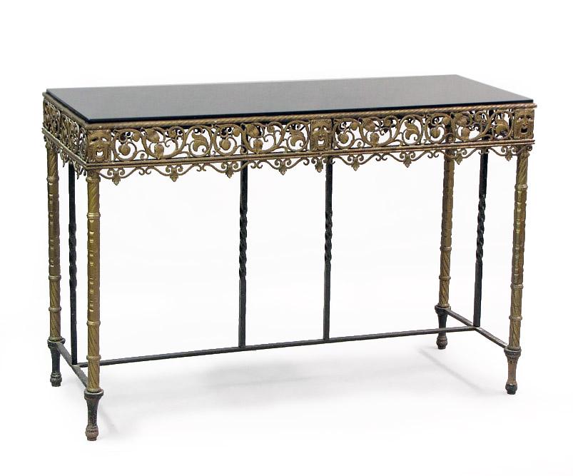 A Console Table.: A Console Table. Patinated metal and iron table base with a glass top. Provenance: Racine Movie Theatre 33 3/4" x 50 1/4" x 19 1/2"