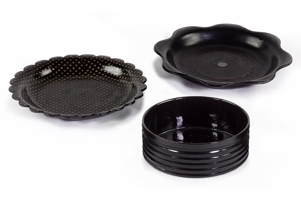 Three 19th Century English Wine Coasters.: Three 19th Century English Wine Coasters. Comprising a black papier mache round wine coaster with ribbed sides and two papier mache wine coasters with lobed edging (Diameter: 6 1/2") Coaster with ribb