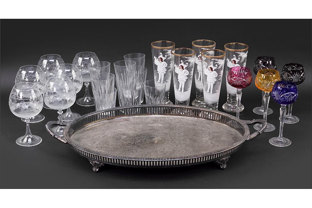 A Collection of Glassware.: A Collection of Glassware. Comprising five German enameled beer glasses, ten crystal highball glasses, five cut-to-clear crystal wine goblets, six etched glass wine goblets and a silverplate double ha