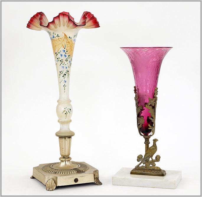 Two Trumpet Form Victorian Glass Vases.: Two Trumpet Form Victorian Glass Vases. Featuring two trumpet form vases in marble and gilt metal bases. The amethyst trumpet vase has an acid etched grape design. The cranberry ribbon edged vase is d