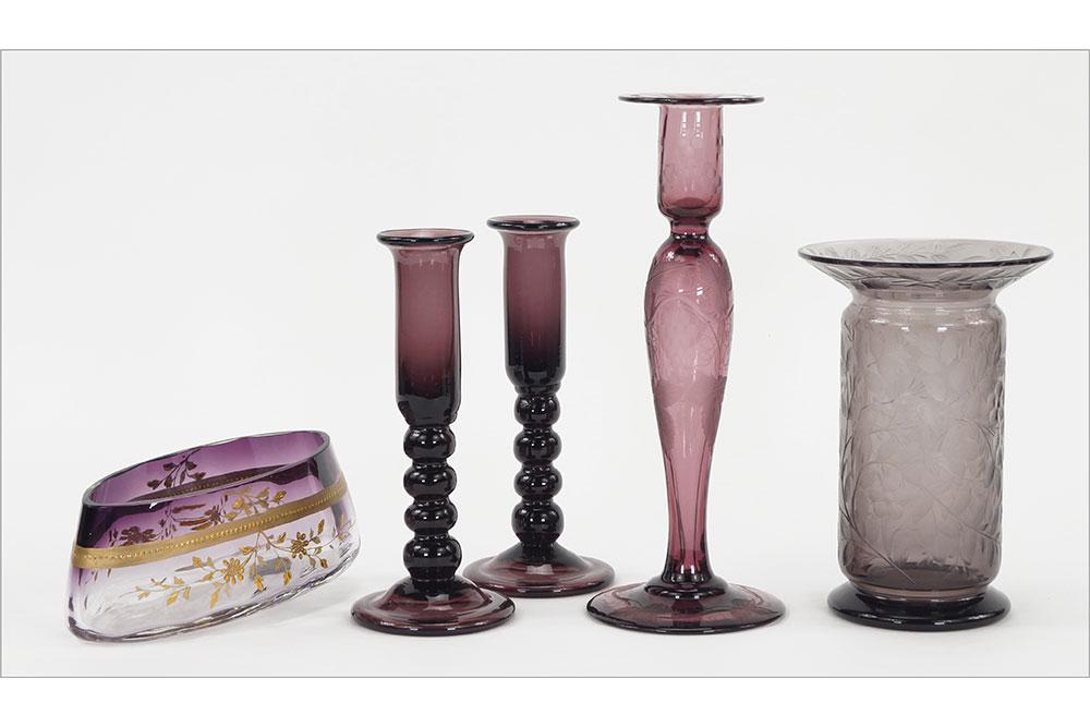 Amethyst Art Glass Vases and Candlesticks.: Amethyst Art Glass Vases and Candlesticks. Consisting of a pair of amethyst glass candlesticks, an amethyst and gilt vase, an acid and needle etched Robert Ramure vase, and a possible Pairpoint grape 
