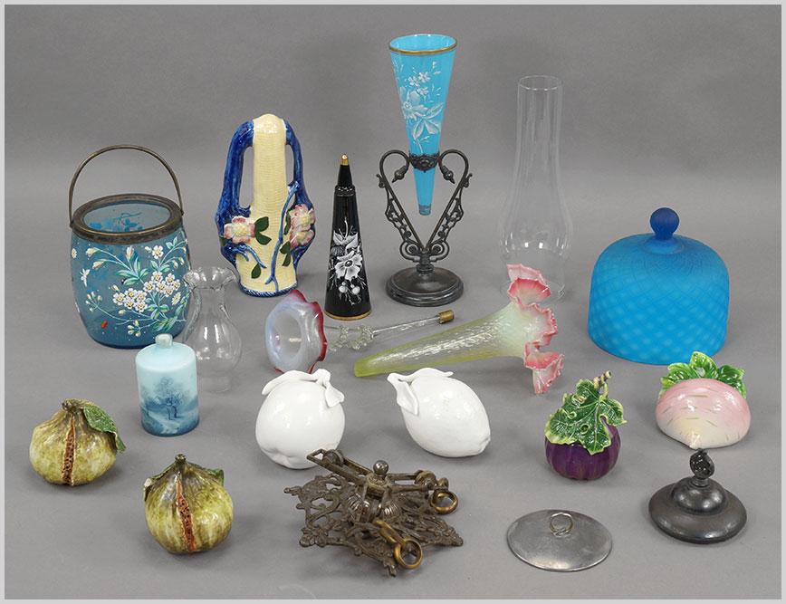 A Group of Decorative Items.: A Group of Decorative Items. Consisting of ceramic fruit, ceramic wall pockets, a diamond quilted cheese dome lid, several trumpet vases missing the metal holder, biscuit jar missing the lid, several 