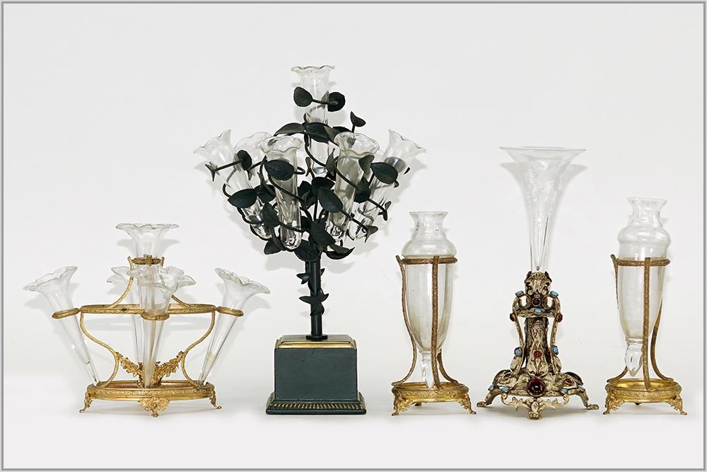 A French Garniture Suite.: A French Garniture Suite. Comprising a gilt metal centerpiece with five glass trumpet form vase inserts and a pair of coordinating gilt metal and clear glass vases. Centerpiece is stamped "Paris Franc