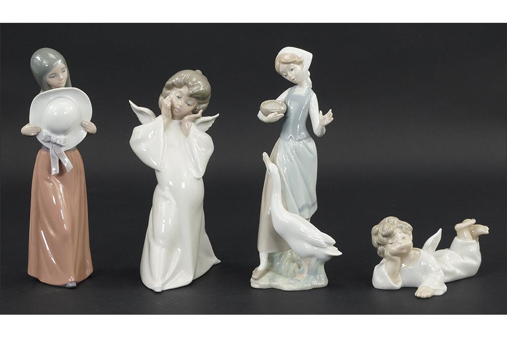 A Lladro Porcelain Figure of Feeding Goose, 1052.: A Lladro Porcelain Figure of Feeding Goose, 1052. Together with three Lladro figures of a girl with hat and two angels Feeding Goose: 10 1/4"