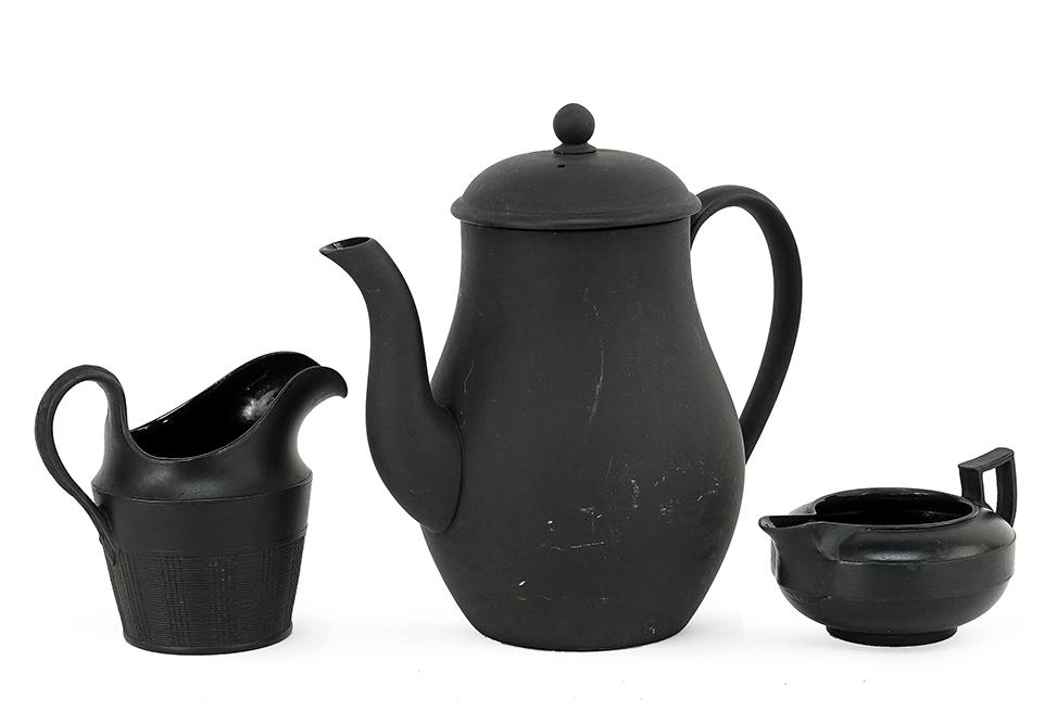 A Wedgwood Basalt Coffee Pot.: A Wedgwood Basalt Coffee Pot. Together with a Wedgwood basalt creamer and a basalt creamer with ribbed lower half Coffee pot height: 7"
