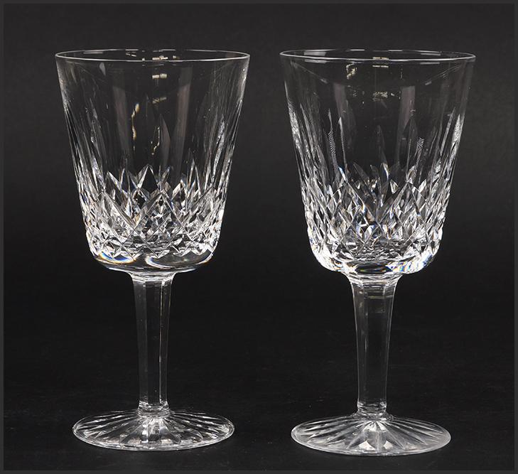 A Set of Twenty-One Waterford Crystal Water Goblets in: A Set of Twenty-One Waterford Crystal Water Goblets in the Lismore Pattern. 6 7/8"