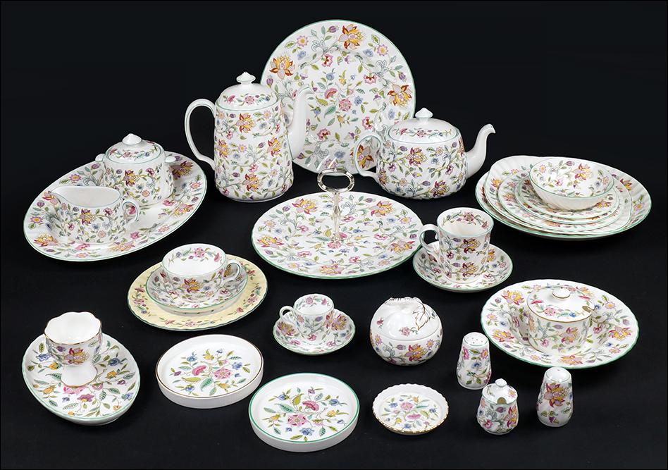 A Minton Partial Dinner Service in the Haddon Hall: A Minton Partial Dinner Service in the Haddon Hall Pattern. Comprising 12 dinner plates (10 5/8"), 14 salad plates, 8 rimmed soup bowls, 14 bread plates (two sizes, 6 1/4" and 6 5/8"), 14 cups, 8 mugs
