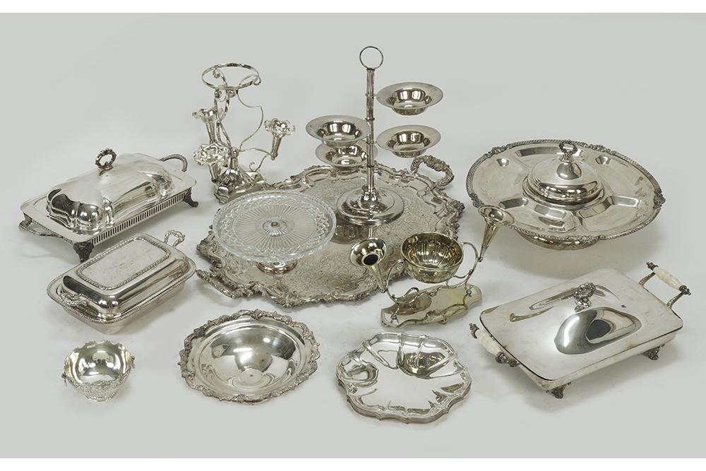 A Collection of Silverplate.: A Collection of Silverplate. Comprising a lazy susan, a four tiered server, a double handled tray, three covered servers, two epergnes, a cake stand, a set of eight chargers and others Lazy susan: 9"