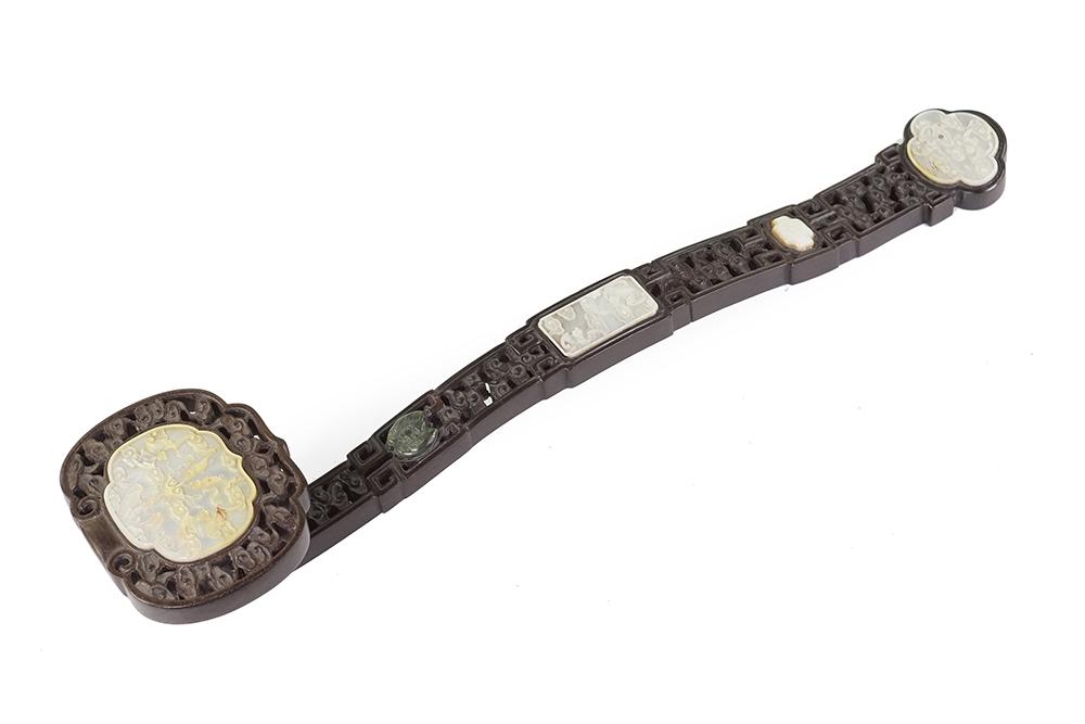 A Chinese Carved Hardwood Ruyi Scepter.: A Chinese Carved Hardwood Ruyi Scepter. Openwork scepter bearing mounted carved mother-of-pearl and hardstone medallions depicting fish and bats Length: 14 3/4"