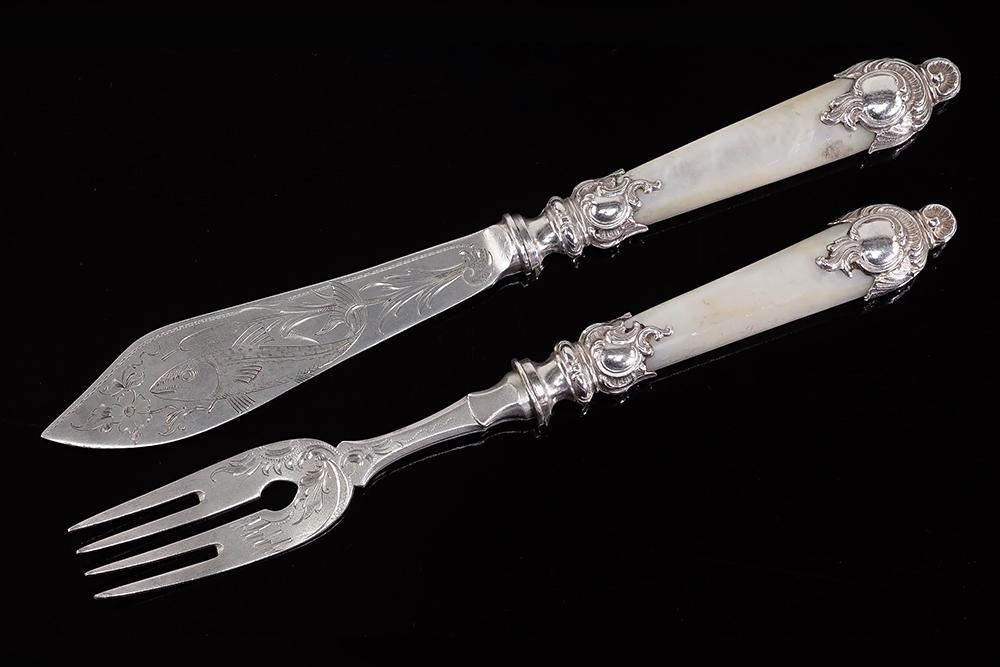 A German Fish Service.: A German Fish Service. Comprising twelve forks and twelve knives. Each utensil has an .800 silver mounted mother-of-pearl handle and .800 silver blade or tines. All pieces are marked for .800 silver a