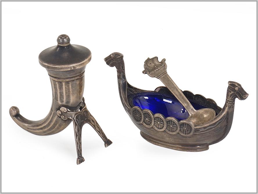 A Swedish Sterling Silver Salt and Pepper Set.: A Swedish Sterling Silver Salt and Pepper Set. Comprising a boat form salt cellar with cobalt glass liner and sterling silver salt spoon and a sterling silver horn of plenty pepper pot