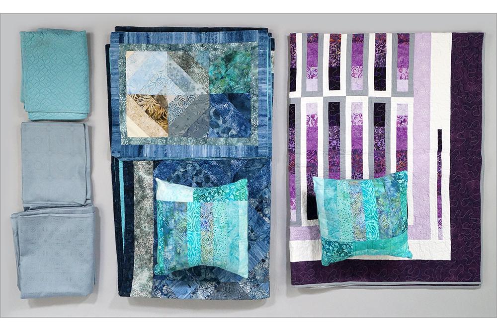 Two Contemporary Hand Made Quilts and Duvet.: Two Contemporary Hand Made Quilts and Duvet. Consisting of a purple and green hand made machine quilted spread and a blue Linea Casa by Sferra Duvet with pillow shams Sferra Duvet: 104" x 96"