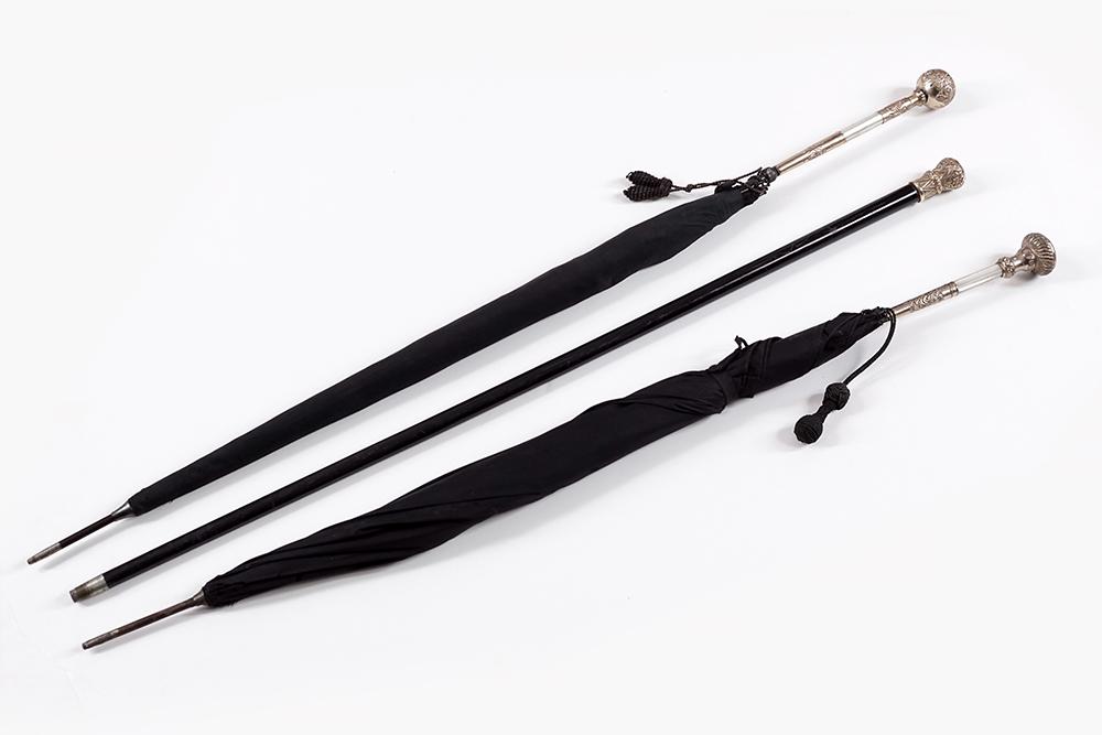 Two Victorian Gold Filled Umbrellas and Walking Cane.: Two Victorian Gold Filled Umbrellas and Walking Cane. Consisting of two gold filled and mother of pearl handle Victorian umbrellas and a Victorian gold filled walking stick Length: 36"