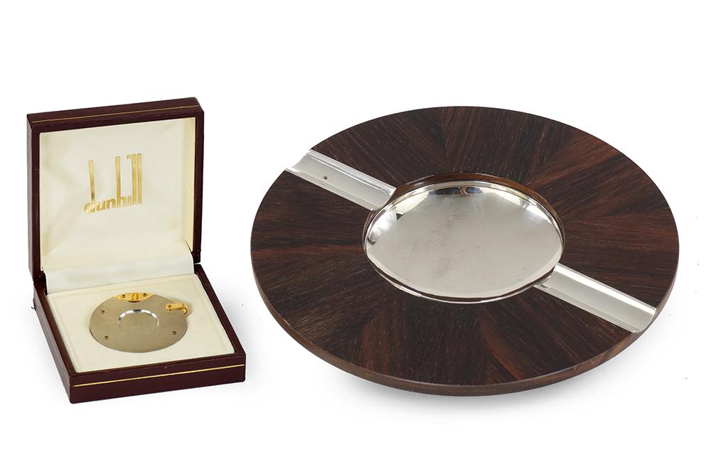 A David Linley for Dunhill Cigar Ashtray.: A David Linley for Dunhill Cigar Ashtray. Exotic wood ashtray with chrome well and cigar rests. Marked for Dunhill and Linley. Together with a Dunhill stainless steel cigar cutter with Dunhill fitted