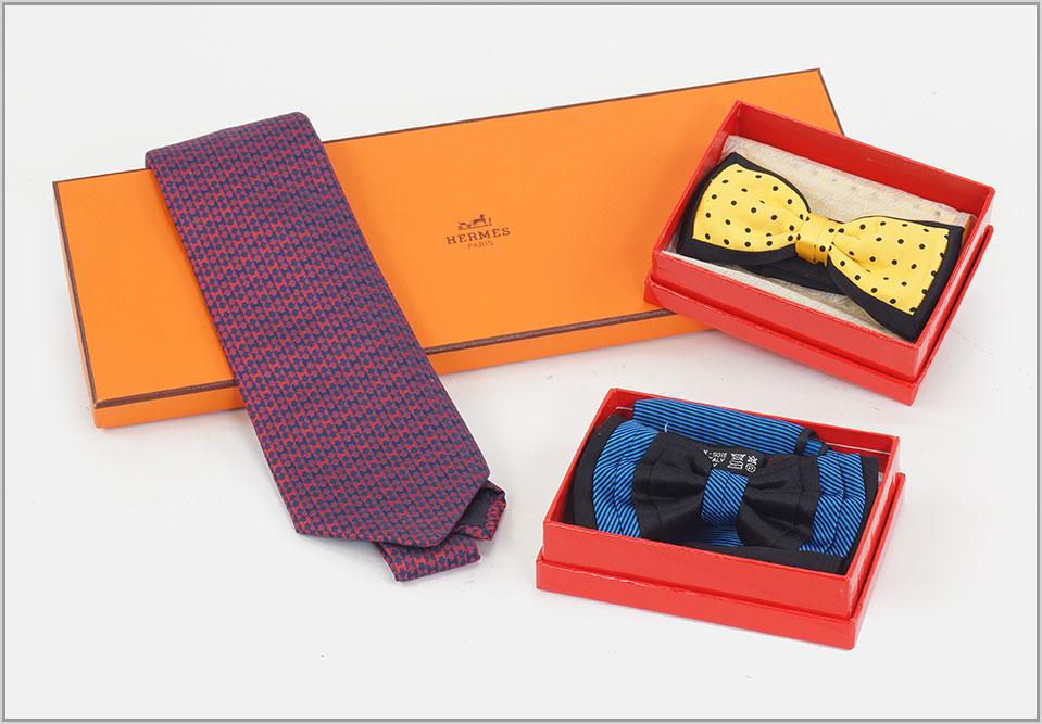 An Hermes Silk Neck Tie.: An Hermes Silk Neck Tie. With Hermes box. Together with two Brioni silk bow ties each with a coordinating pocket square and Brioni box