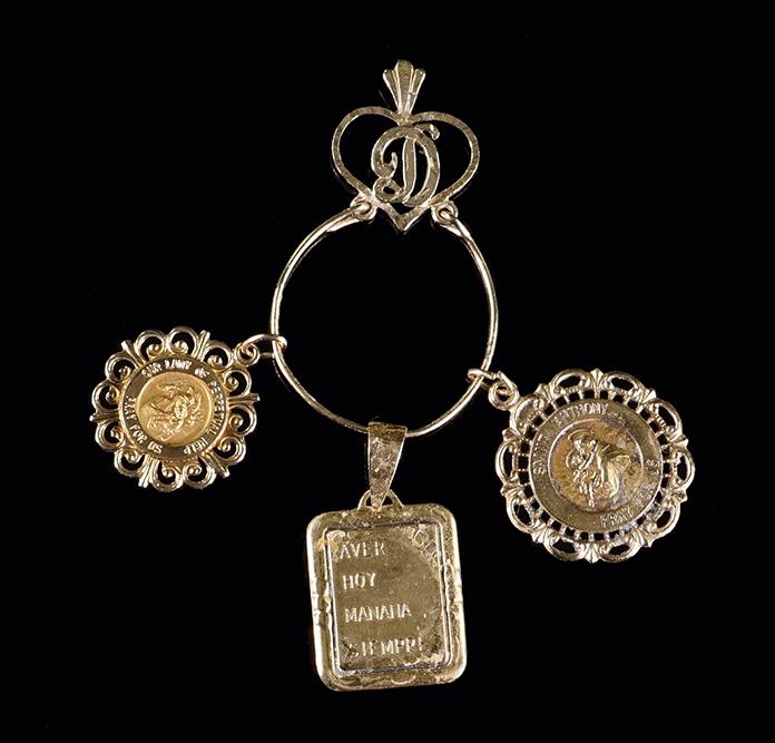 A Collection of Yellow Gold Pendants.: A Collection of Yellow Gold Pendants. 14 karat yellow gold pendant holder contains three 14 karat yellow gold pendants; one Saint Anthony, one Our Lady of Perpetual Help and one love phrase Wt of all:
