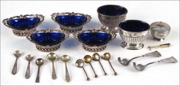 SET OF FOUR SILVERPLATE SALT CELLARS WITH COBAL: SET OF FOUR SILVERPLATE SALT CELLARS WITH COBALT GLASS LINERS. Together with one pair of English silverplate salt cellars with cobalt glass liners, five sterling silver salt spoons, and one Gorham ste