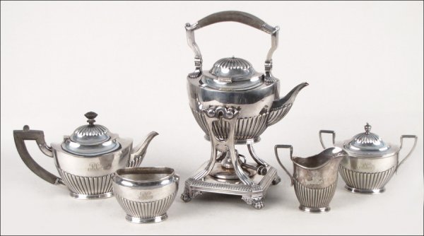 TIFFANY & CO MAKERS SILVER SOLDERED FIVE PIECE : TIFFANY & CO MAKERS SILVER SOLDERED FIVE PIECE TEA SERVICE. Comprised of a water kettle on stand, teapot, creamer, covered sugar bowl, and waste pot. All pieces marked "Tiffany & Co, Makers", and mono