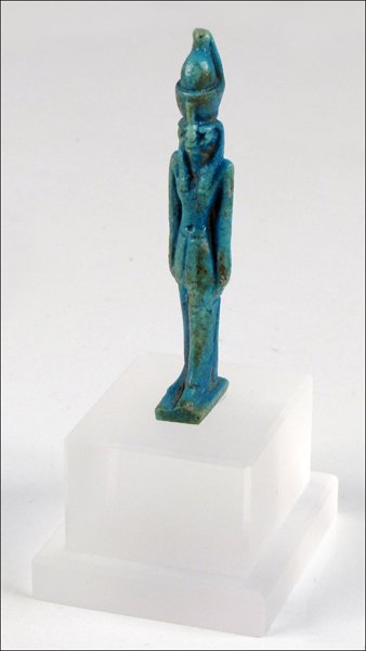 EGYPTIAN BLUE FAIENCE AMULET FIGURE OF HORUS, CIRCA 6TH: EGYPTIAN BLUE FAIENCE AMULET FIGURE OF HORUS, CIRCA 6TH-4TH CENTURY B.C. Depicted wearing the double crown of upper and lower Egypt Height: 3.5"