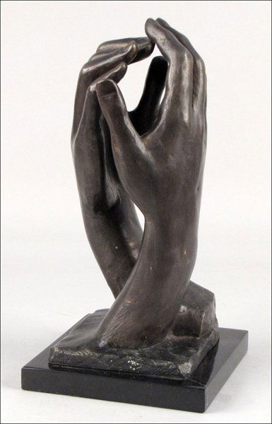 BRONZE HANDS IN THE STYLE OF AUGUSTE RODIN.: BRONZE HANDS IN THE STYLE OF AUGUSTE RODIN. Unsigned, raised on a square marble base Height: 14"
