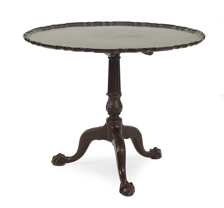 A Chippendale Style Carved Mahogany Tea Table.: A Chippendale Style Carved Mahogany Tea Table. Tilt top tea table raised on three ball and claw feet with a piecrust edge Height: 29" Diameter: 35"