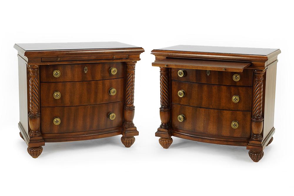A Pair of Broyhill Night Stands.: A Pair of Broyhill Night Stands. Empire style wood night stands with three drawers and a pullout surface 31" x 34" x 19"