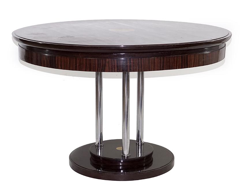 An Art Deco Occasional Table.: An Art Deco Occasional Table. Mahogany table bearing inset leather to the upper surface and center of base, a macassar apron, and chrome legs 33" x 51"