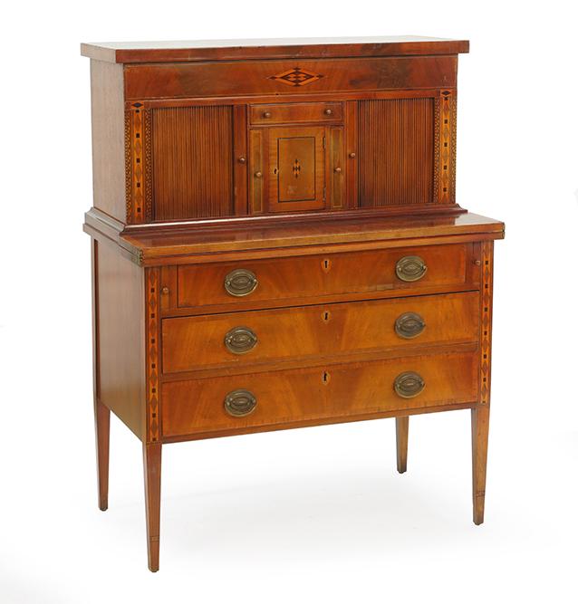 A Hepplewhite Inlaid Mahogany Desk.: A Hepplewhite Inlaid Mahogany Desk. Comprising a central storage cabinet flanked by vertical drawers and tambor doors which conceal drawers and letter racks. With flipover writing surface 46 1/2" x 35
