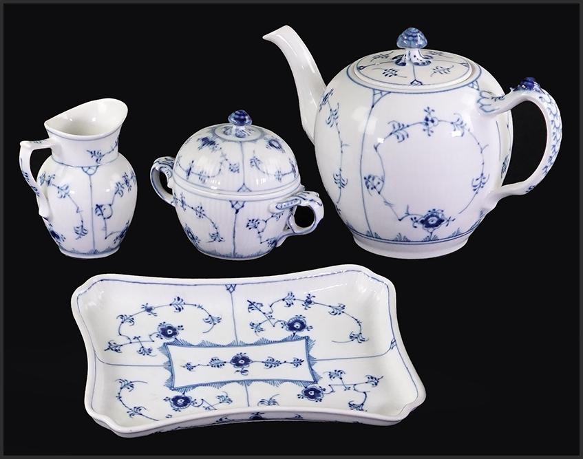 A Royal Copenhagen Porcelain Tea Service.: A Royal Copenhagen Porcelain Tea Service. Blue Fluted plain pattern comprising a teapot, a creamer, a covered sugar bowl and a tray