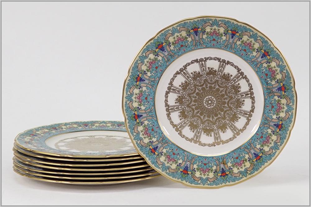 A Set of Eight Lenox Porcelain Plates.: A Set of Eight Lenox Porcelain Plates. Gilt and enameled porcelain plates with flower baskets forming the perimeter. Reverse is numbered "1445 / J453" Diameter: 10 1/2"