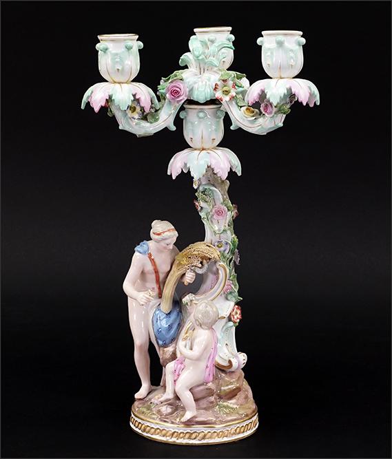 A Meissen Porcelain Candelabra.: A Meissen Porcelain Candelabra. Figural painted porcelain base with a removable three-light candelabra insert 13 1/2" x 7"