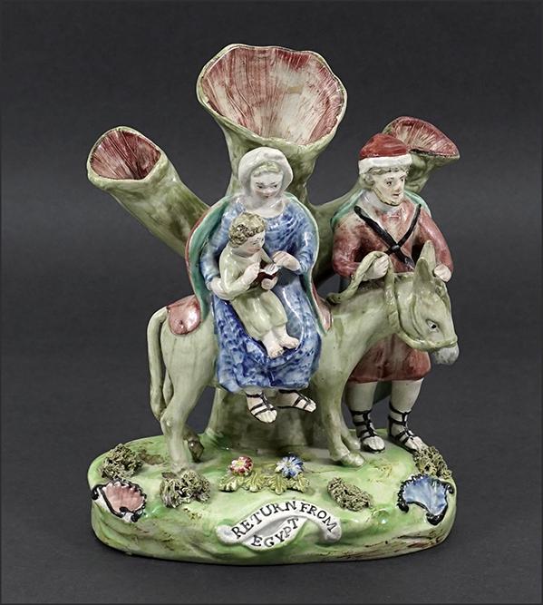 A Walton Staffordshire Figural Spill Vase.: A Walton Staffordshire Figural Spill Vase. Depicting the "Return from Egypt" of Mary, Joseph and Jesus 7 5/8" x 6" x 3 1/2"