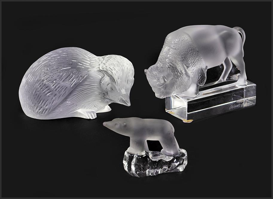 Two Lalique Frosted Glass Animals.: Two Lalique Frosted Glass Animals. Including a hedgehog and a bison. Together with a frosted glass glass polar bear. Lalique bears maker's marks Hedgehog: 2 3/4" x 5 1/2" x 3 1/2"