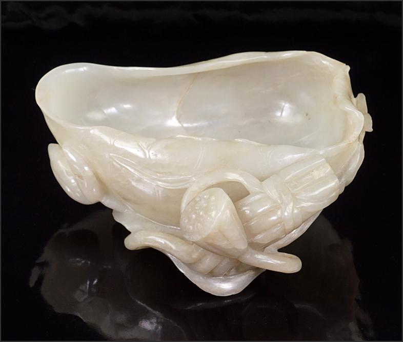 A Chinese Carved Jade Brush Washer.: A Chinese Carved Jade Brush Washer. In the form of a lotus flower 2 1/4" x 5 1/2" x 5 1/4"