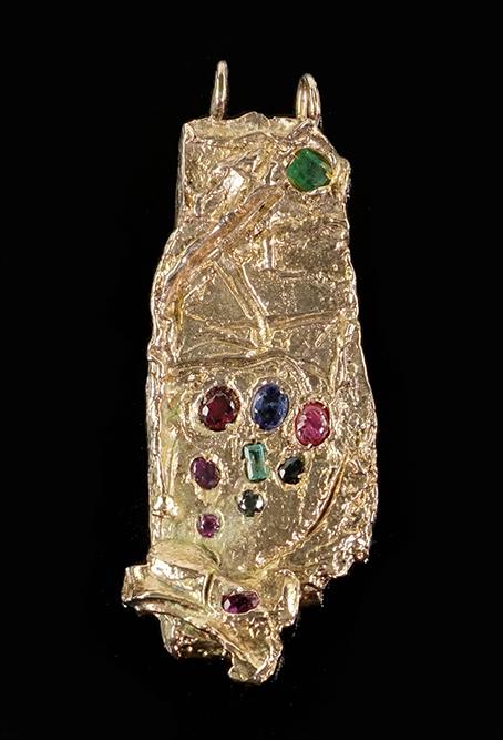 Igael Tumarkin (Israeli/German, B. 1933) A Pendant.: Igael Tumarkin (Israeli/German, B. 1933) A Pendant. Gilt bronze pendant mounted with sapphires, emeralds, rubies and semi-precious stones. Signed on the reverse 4 1/4" x 1 7/8" Wt: 152 grams