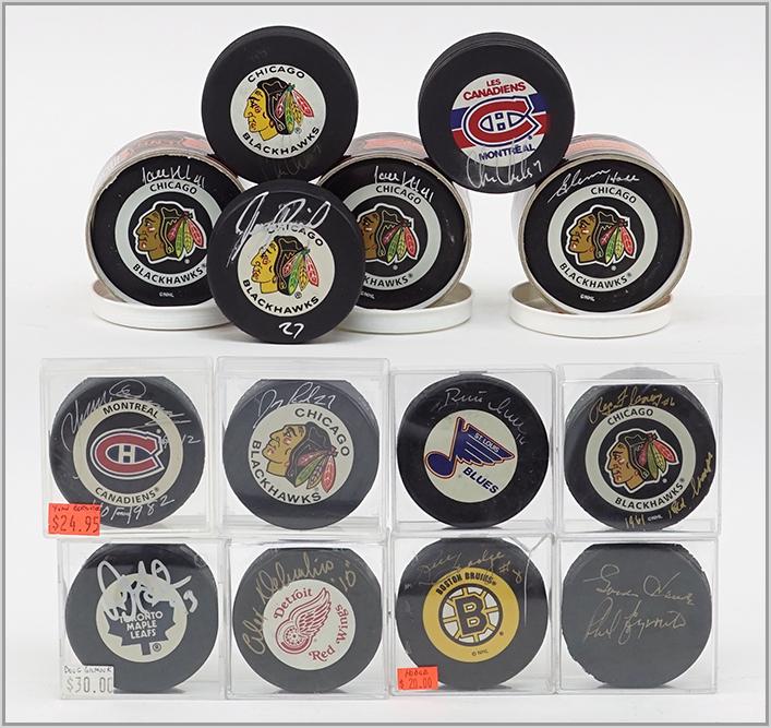 FOURTEEN SIGNED HOCKEY PUCKS.: FOURTEEN SIGNED HOCKEY PUCKS. Consisting of Chicago Blackhawks, Toronto Maple Leafs, Montreal Canadiens, Detroit Red Wings, St. Louis Blues and Boston Bruins