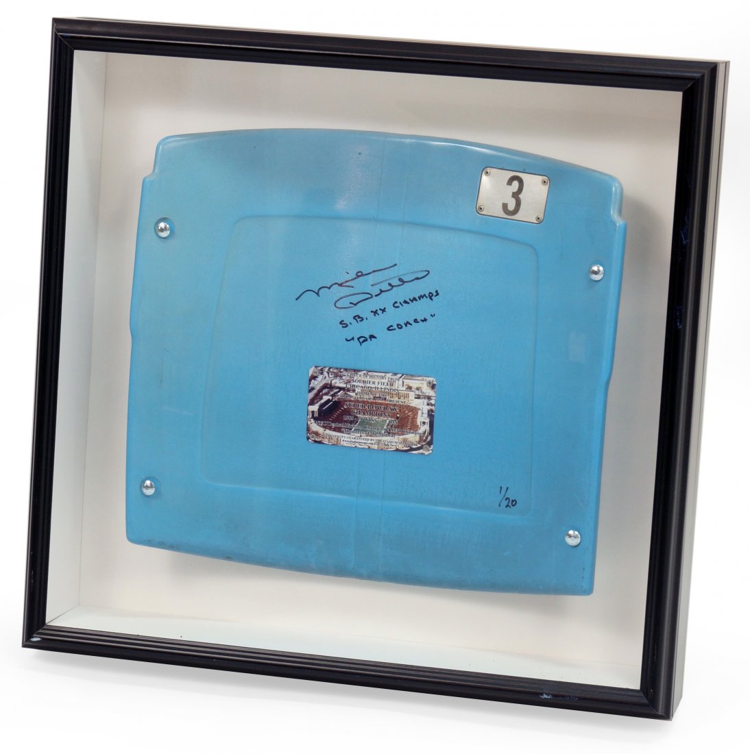 Mike Ditka (American, B. 1939) A Signed Soldier Field: Mike Ditka (American, B. 1939) A Signed Soldier Field Seat. Signed stadium seat reads "Mike Ditka / S.B. XX Champs / "Da Coach" / 1/20". Mounted within a shadowbox frame Seat: 17" x 18" Frame: 24 1/2"