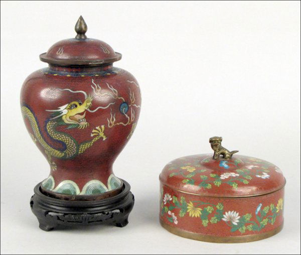 19TH CENTURY CLOISONNE COVERED GINGER JAR.: 19TH CENTURY CLOISONNE COVERED GINGER JAR. In a dragon motif over a red ground. Together with a cloisonne covered round box with interior compartments and a foo dog finial Ginger jar: 9"