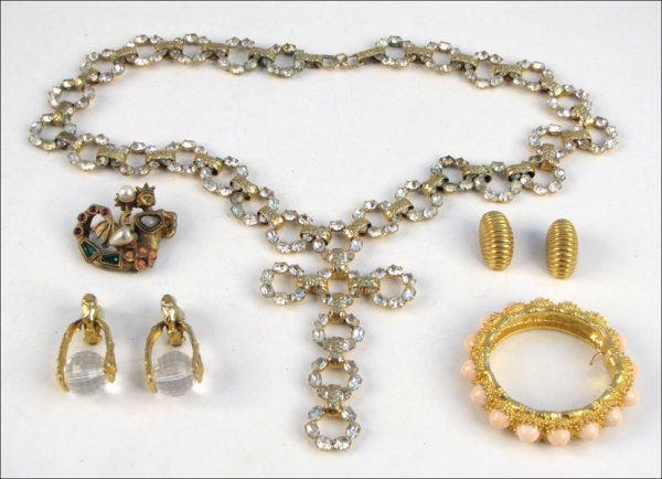 GROUP OF KENNETH JAY LANE JEWELRY.: GROUP OF KENNETH JAY LANE JEWELRY. Comprised of a mermaid form faux pearl, glass, and gilt metal brooch, a faux angel coral studded bangle bracelet, two pairs of earclips, and a white rhinestone neckl