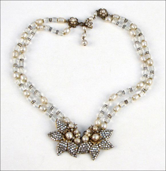 MIRIAM HASKELL TWO-STRAND NECKLACE.: MIRIAM HASKELL TWO-STRAND NECKLACE. Comprised of faux baroque pearls, white rhinestones, and glass beads leading into a double floral center Length: 22"