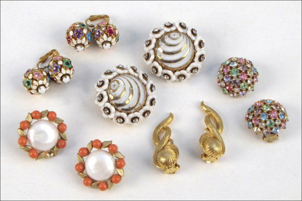FIVE PAIRS OF SIGNED EARCLIPS.: FIVE PAIRS OF SIGNED EARCLIPS. Comprised of one pair of Trifari orange bead and faux pearl earclips, one pair of Jomaz rhinestone and white enamel earclips, one pair of Vogue enamel and multi-colored