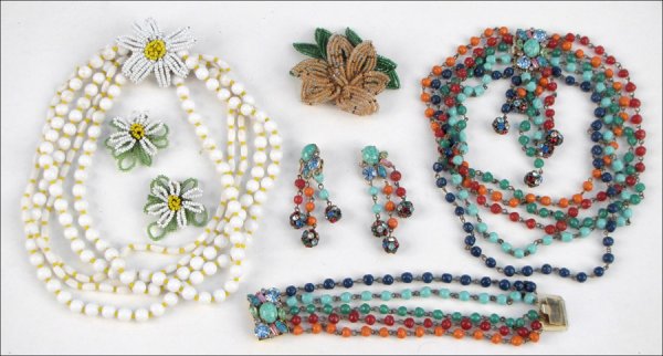 HATTIE CARNEGIE BEADED FLOWER DEMI-PARURE.: HATTIE CARNEGIE BEADED FLOWER DEMI-PARURE. Comprised of a five-strand bead necklace with beaded flower clasp, and earclips. Together with a Hobe beaded flower brooch, and an Alice Caviness glass bead 