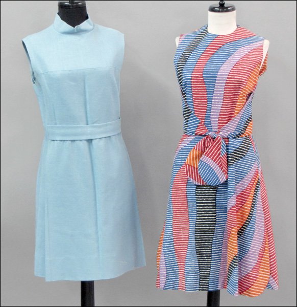 GEOFFREY BEENE BOUTIQUE MULTI-COLORED COTTON PR: GEOFFREY BEENE BOUTIQUE MULTI-COLORED COTTON PRINT DAY DRESS. With front slash pockets and a faux tie closure at the waist. Dress is fully silk lined. Together with a Bonwit Teller light blue linen da