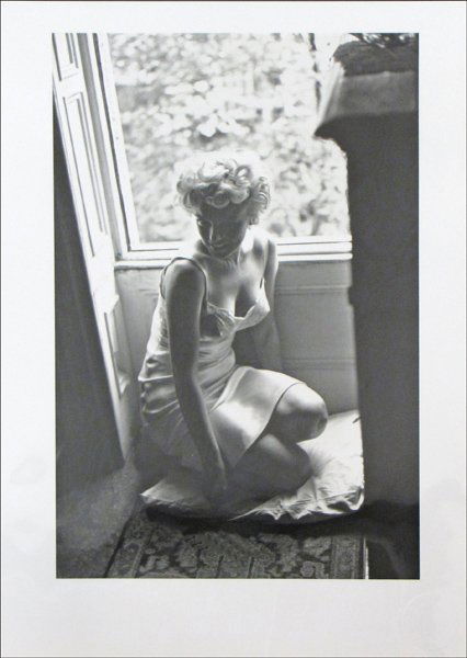 SAM SHAW (AMERICAN 1912-1999) MARILYN NEAR A WI: SAM SHAW (AMERICAN 1912-1999) MARILYN NEAR A WINDOW - DURING THE FILMING OF THE SEVEN YEAR ITCH. Black and white photograph, 1954, number 4 from portfolio A of The Joy of Marilyn, with Sam Shaw emboss
