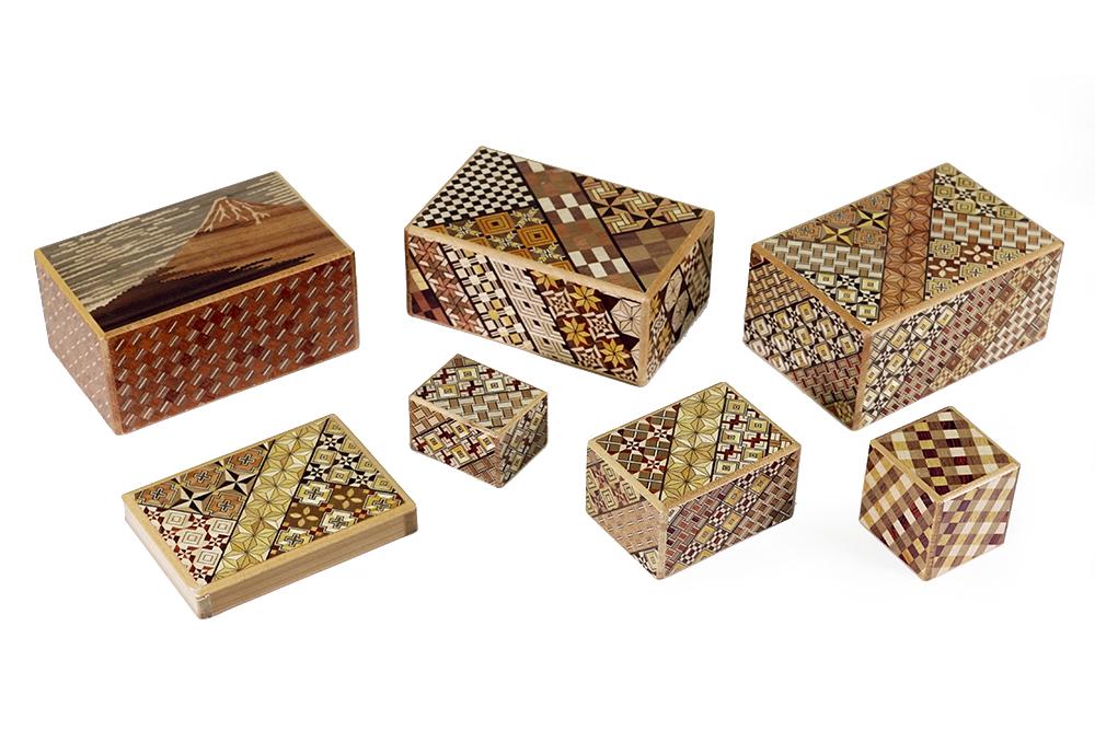 A Collection of Japanese Mixed Inlay Wood Puzzle Boxes. (1 of 1)