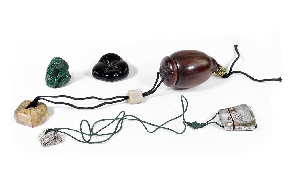 Two Inro.: Two Inro. Comprising a mother-of-pearl inro depicting mountains and a turned wood inro. Together with a malachite netsuke and a carved wood face form button (1 3/4" x 2")